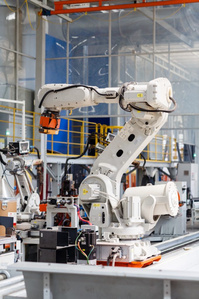 Industrial photo of Robot which working on modern factory and doing laser cutting