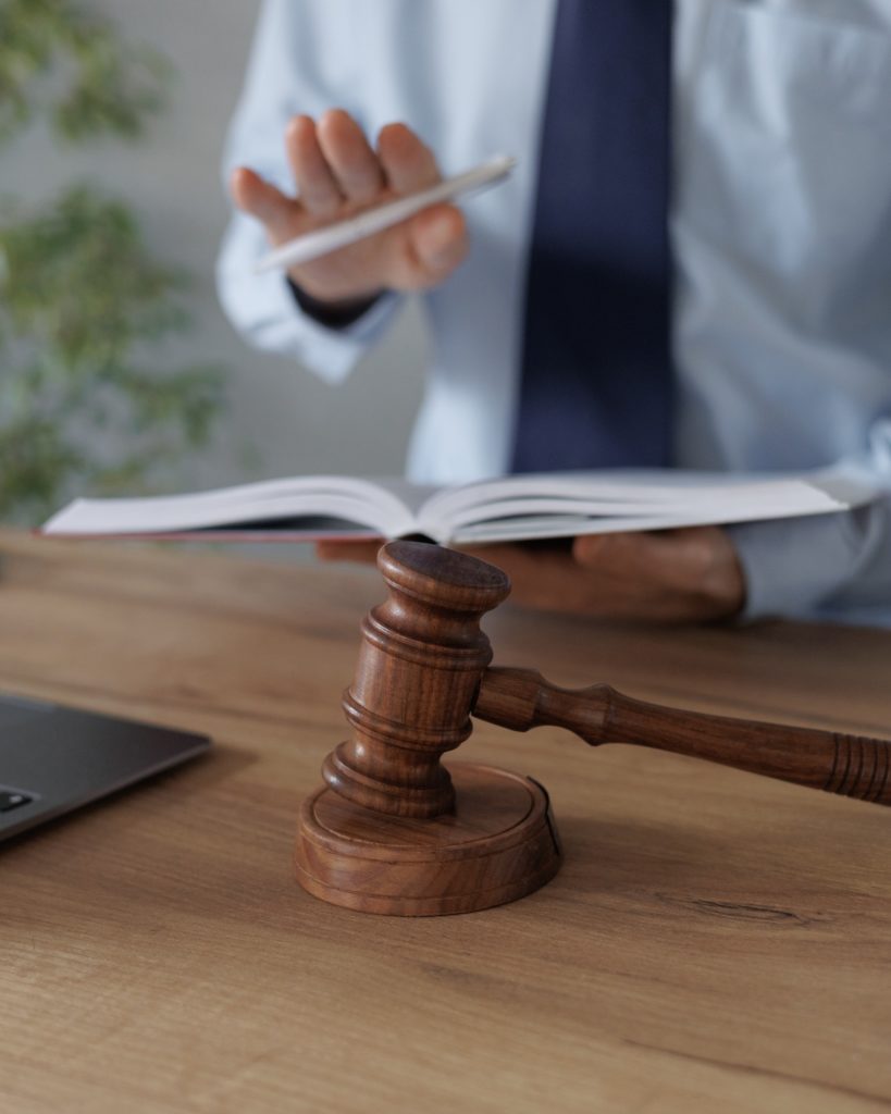 a European male lawyer talks to clients on a webcam from a laptop. work in a law firm